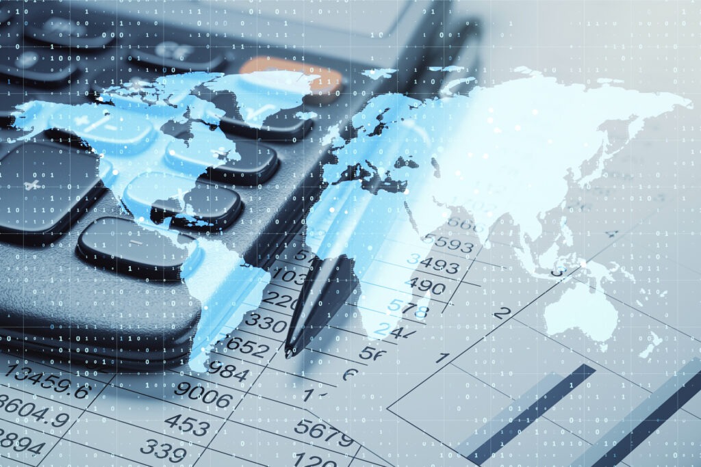Page image of global communications showing calculator, pen and financial reports