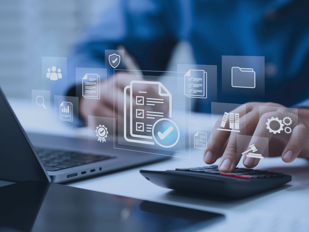 Audit Support and Internal Controls Services image of document checklist and hand on calculator