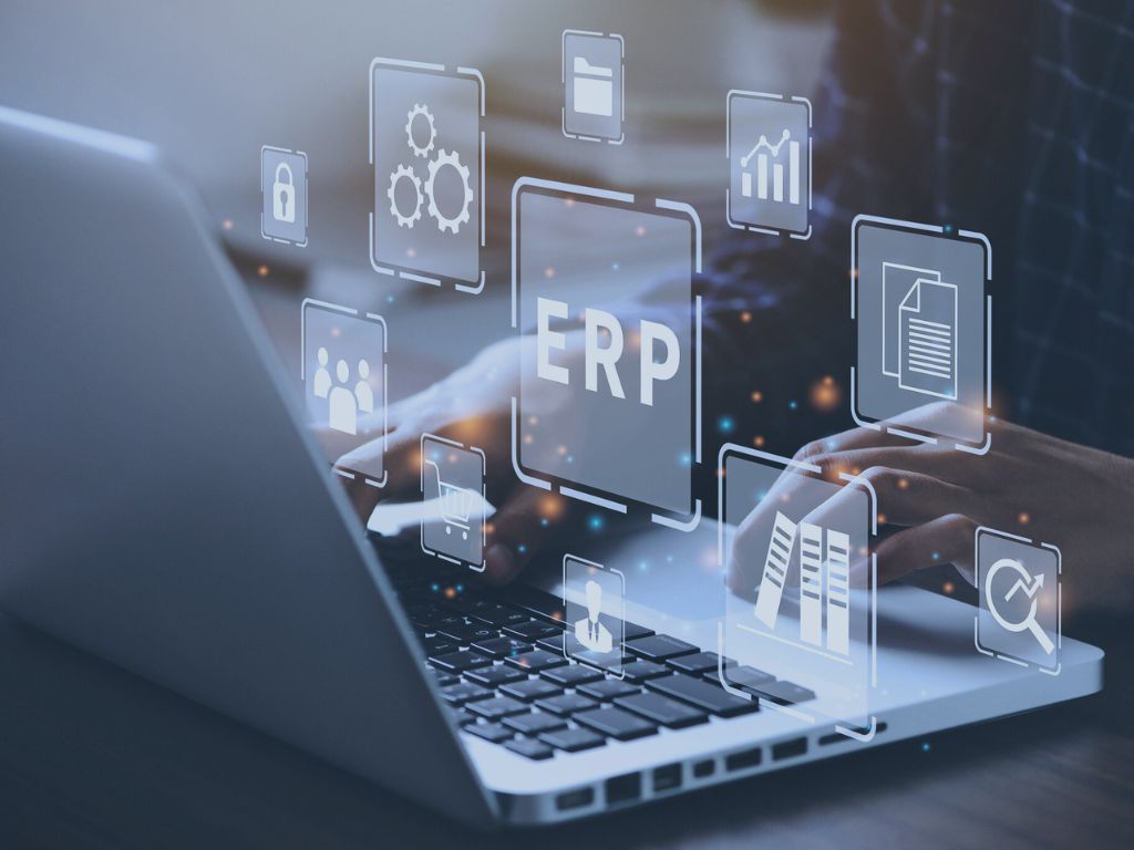 ERP Implementation & Support service image of ERP and related icons with a laptop