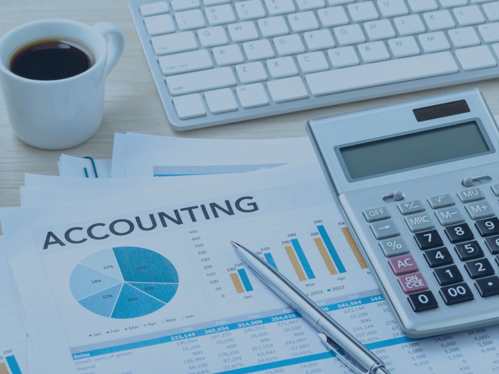 Outsourced Accounting services image printing accounting documents with calculator