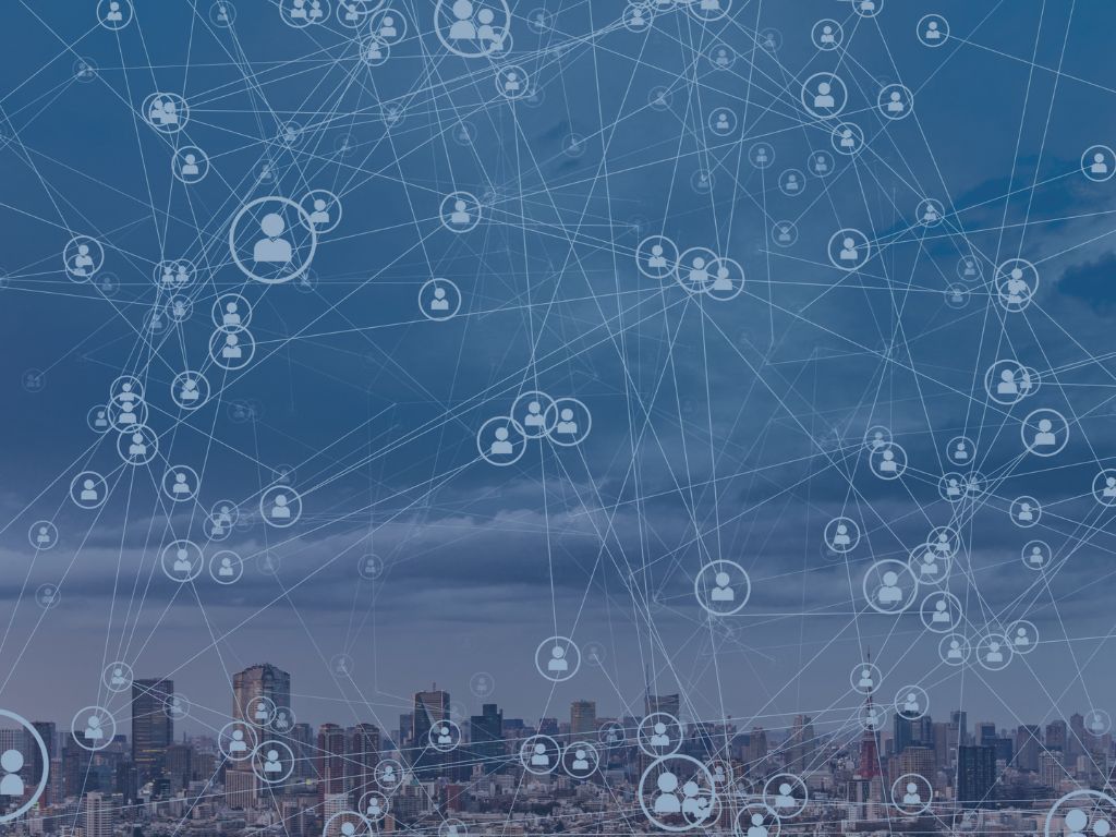 Staffing image of person icons and city skyline with tech overlay