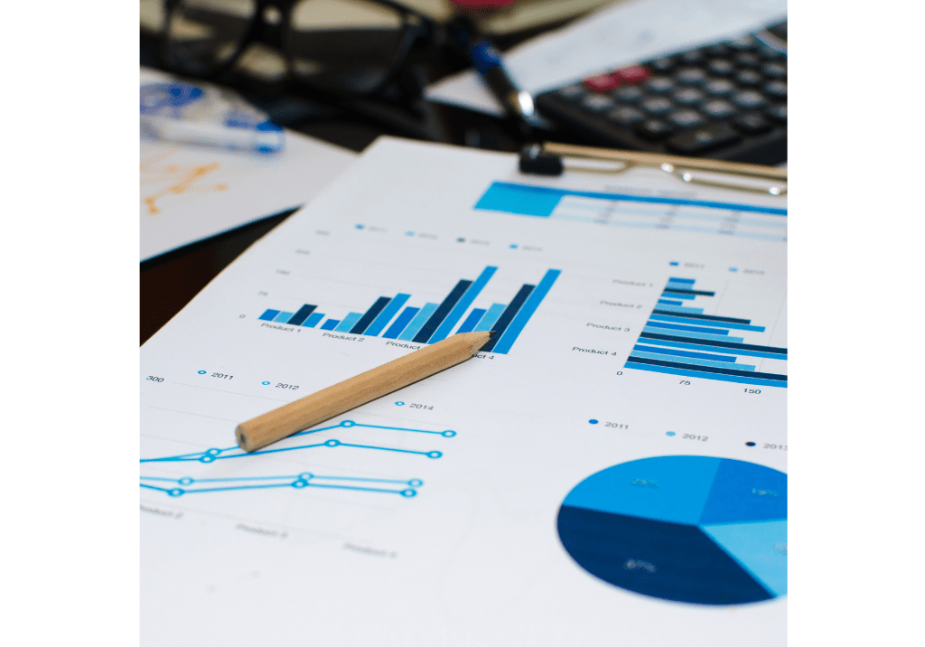 Close-up of financial reports featuring charts, graphs, and performance metrics on a desk. The image represents the transition from accounting support to strategic financial partnership, highlighting financial visibility, business planning, reporting, and informed decision-making.