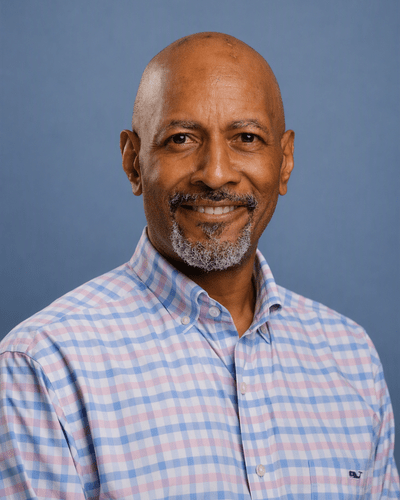 Professional headshot photo of Louis Delouiser