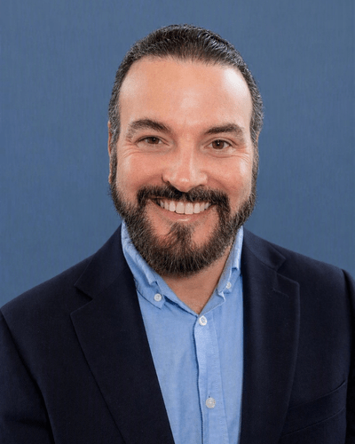 Professional headshot photo of J Max Sullivan