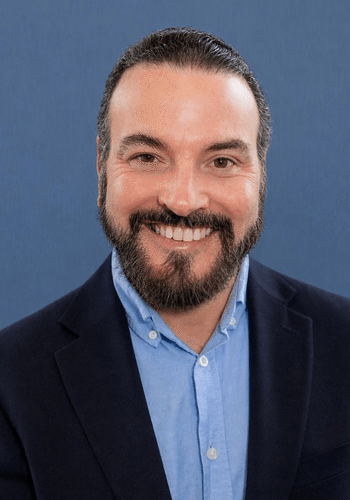 Professional headshot photo of J Max Sullivan